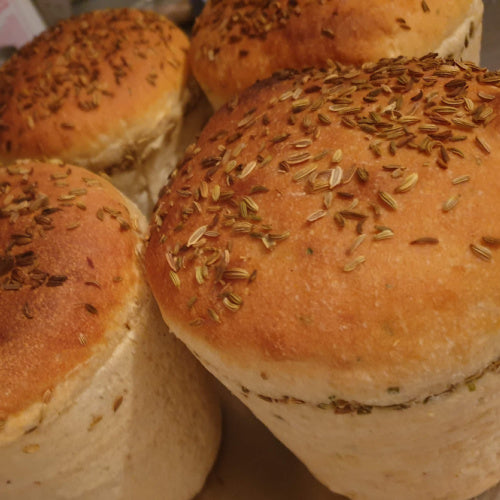 "Freshly baked Bara Pot Clai topped with fennel seeds. traditional Welsh bread Llansteffan