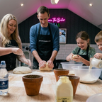 The same family now all wearing black jamiethebaker.com aprons